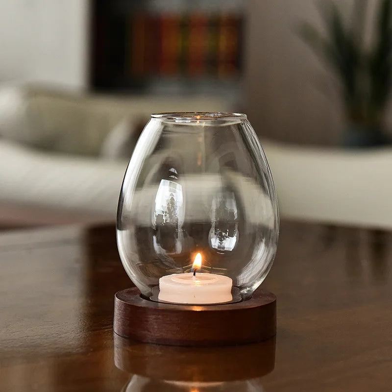 Kerzenhalter aus transparentem Glas als runde Teelichtleuchter
