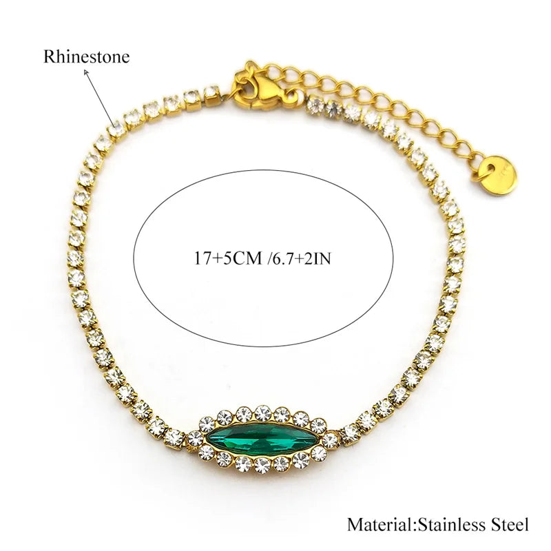 Goldfarbenes Edelstahl Armband mit blau grünem Auge und Strass für Damen