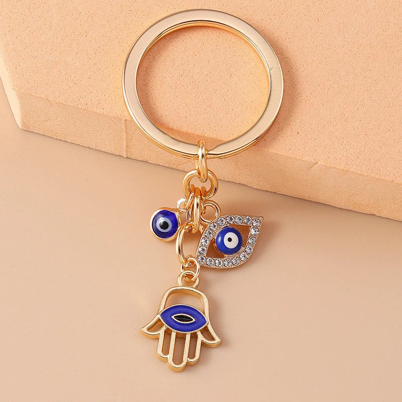 Trendiger Metall Schlüsselanhänger Böser Blick in Gold – Unisex - Stilvoll