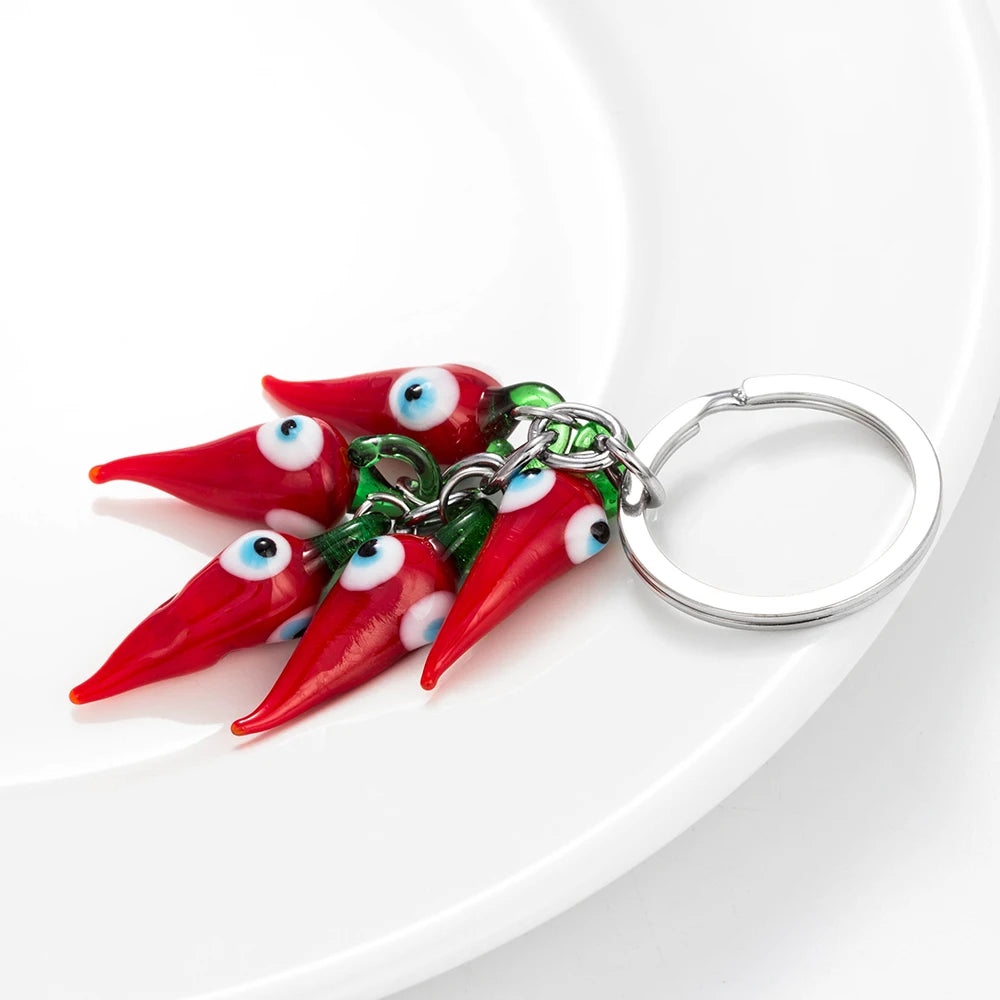 Schützender Red Chilli Schlüsselanhänger mit Perle - Quaste – Unisex Style