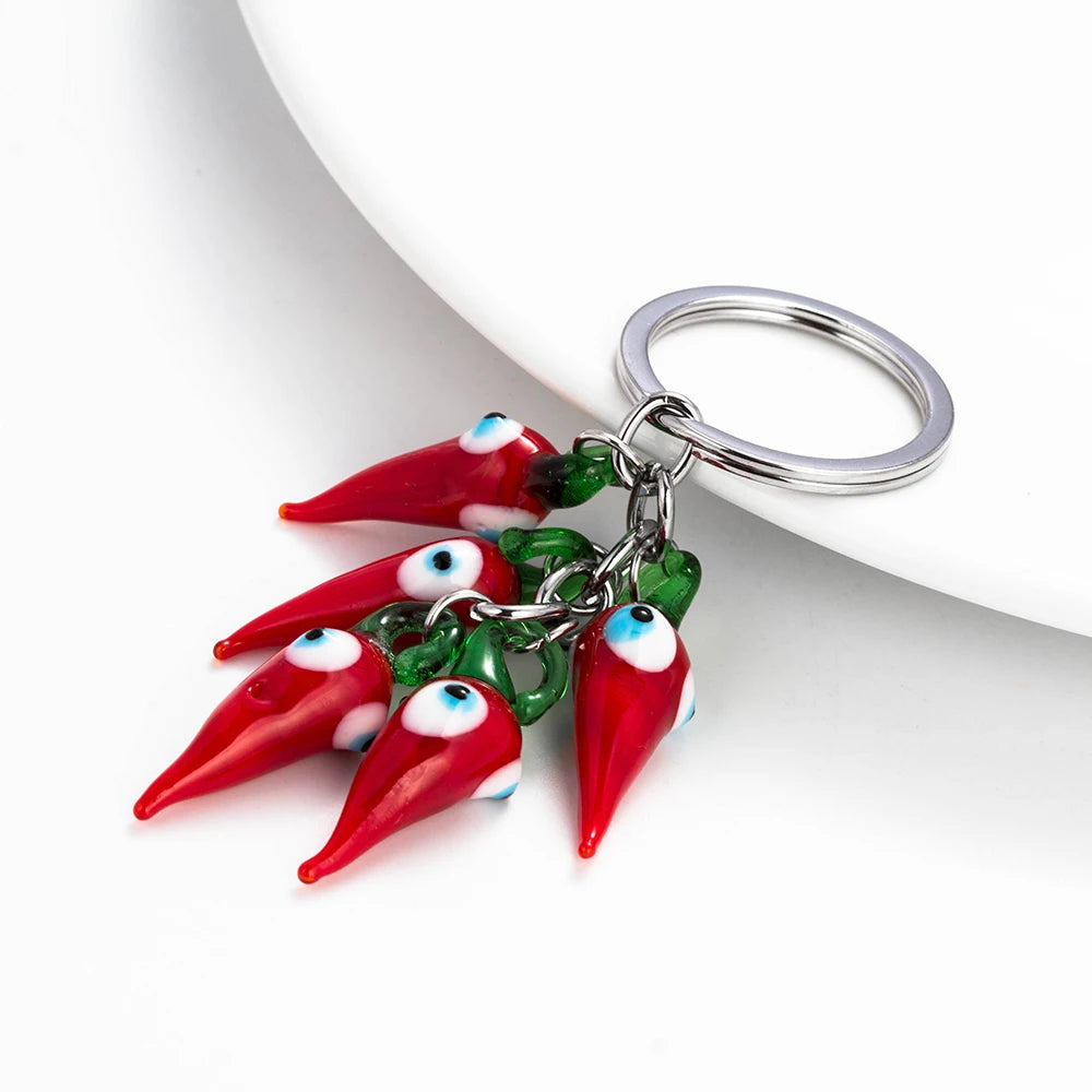 Schützender Red Chilli Schlüsselanhänger mit Perle - Quaste – Unisex Style