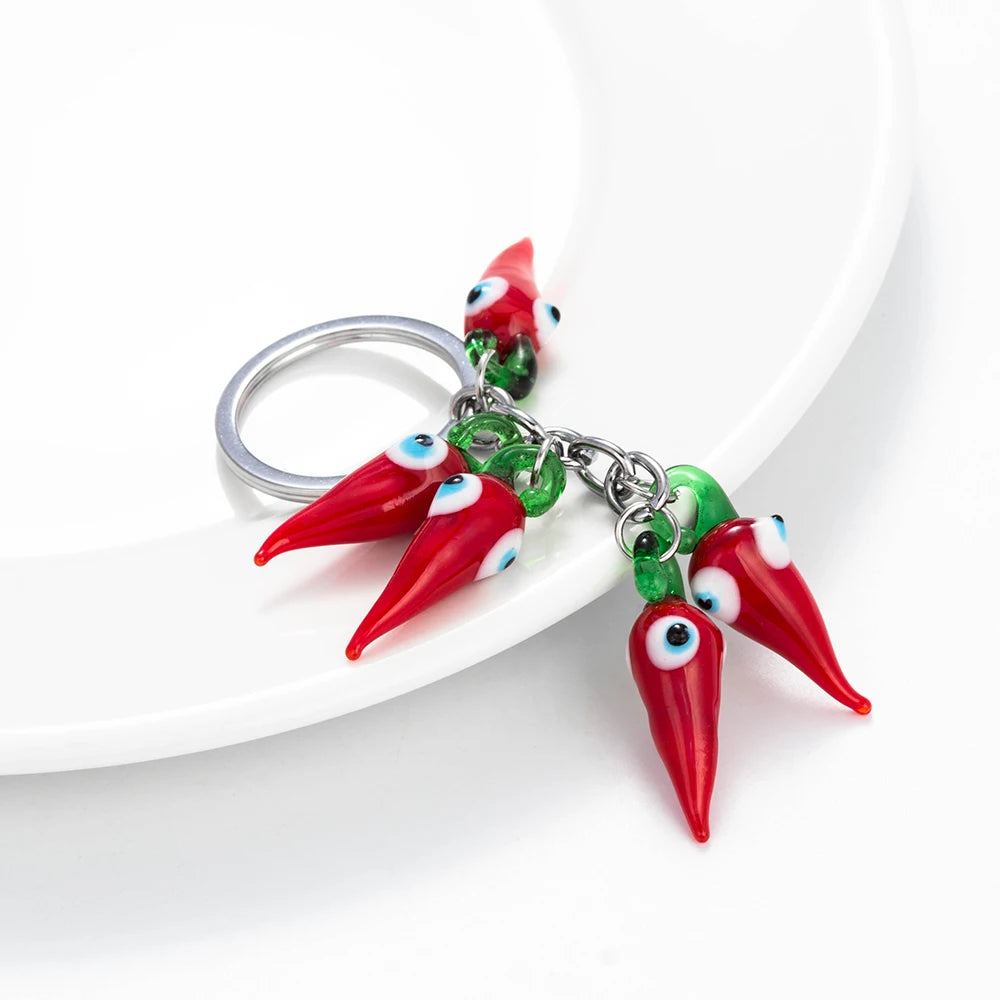 Schützender Red Chilli Schlüsselanhänger mit Perle - Quaste – Unisex Style