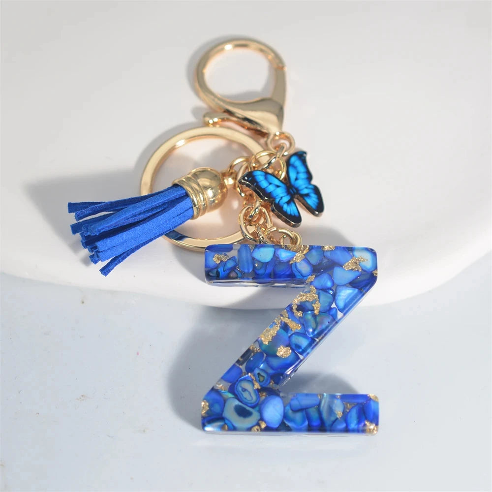 Blauer Buchstaben Schlüsselanhänger mit Quaste und Schmetterling 26 Initialen