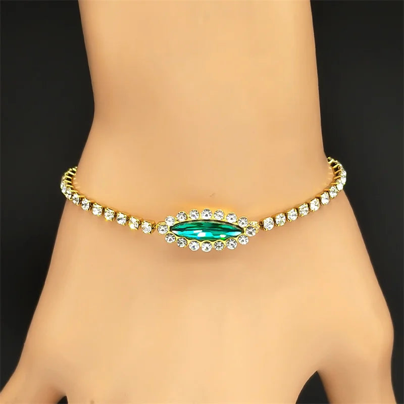 Goldfarbenes Edelstahl Armband mit blau grünem Auge und Strass für Damen
