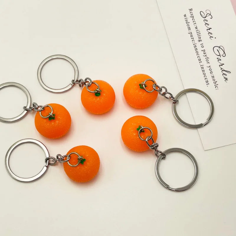 Kreativer Orangen-Schlüsselanhänger aus Resin - Silber für stilvollen Alltag