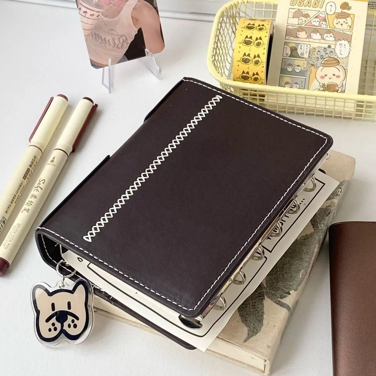 Bindemittel A7 Notizbuch abnehmbar loseblattig dunkelbraun weiß Kunstleder