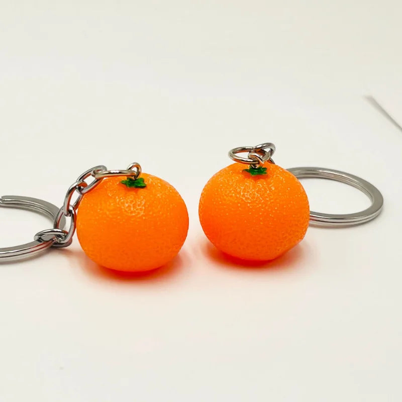 Kreativer Orangen-Schlüsselanhänger aus Resin - Silber für stilvollen Alltag