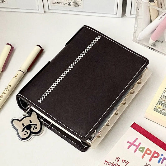 Bindemittel A7 Notizbuch abnehmbar loseblattig dunkelbraun weiß Kunstleder