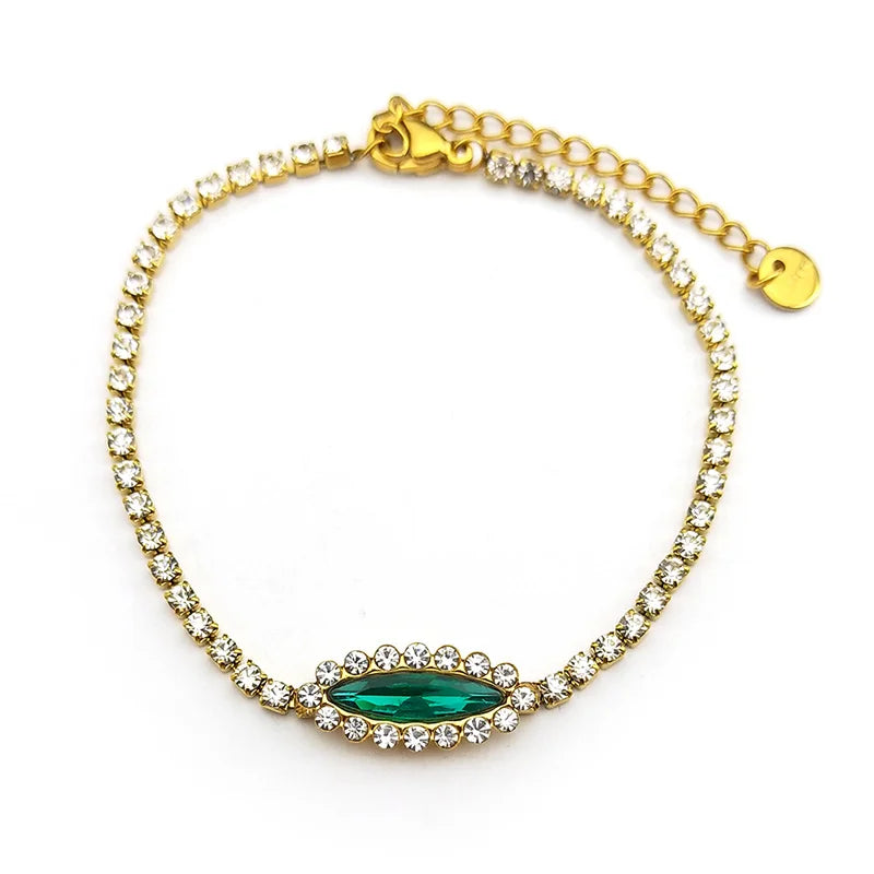Goldfarbenes Edelstahl Armband mit blau grünem Auge und Strass für Damen