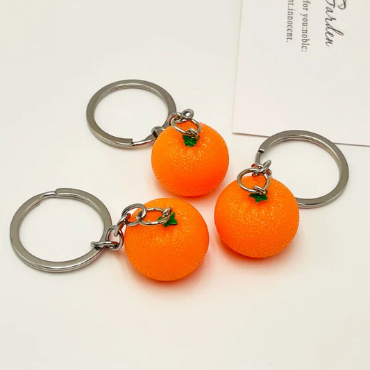 Kreativer Orangen-Schlüsselanhänger aus Resin - Silber für stilvollen Alltag