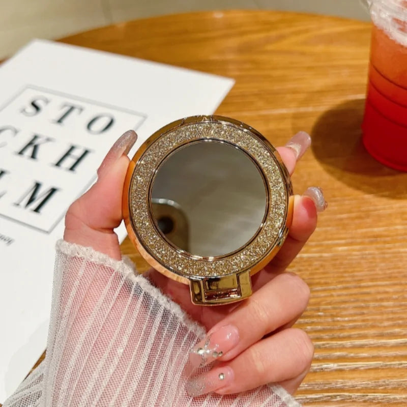 Glitzer-Handyhalter mit Ringgriff und runder Spiegel fürs Smartphone