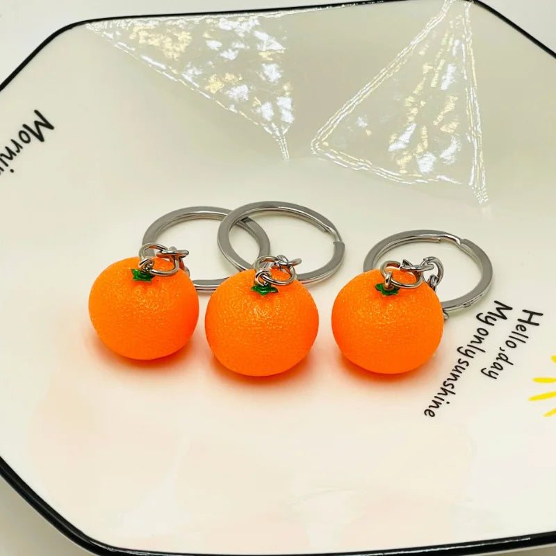 Kreativer Orangen-Schlüsselanhänger aus Resin - Silber für stilvollen Alltag