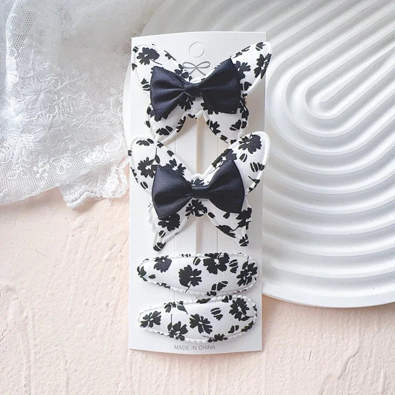 4-teiliges Haarschmuck Set für Mädchen mit Schmetterlingsdesign aus Polyester